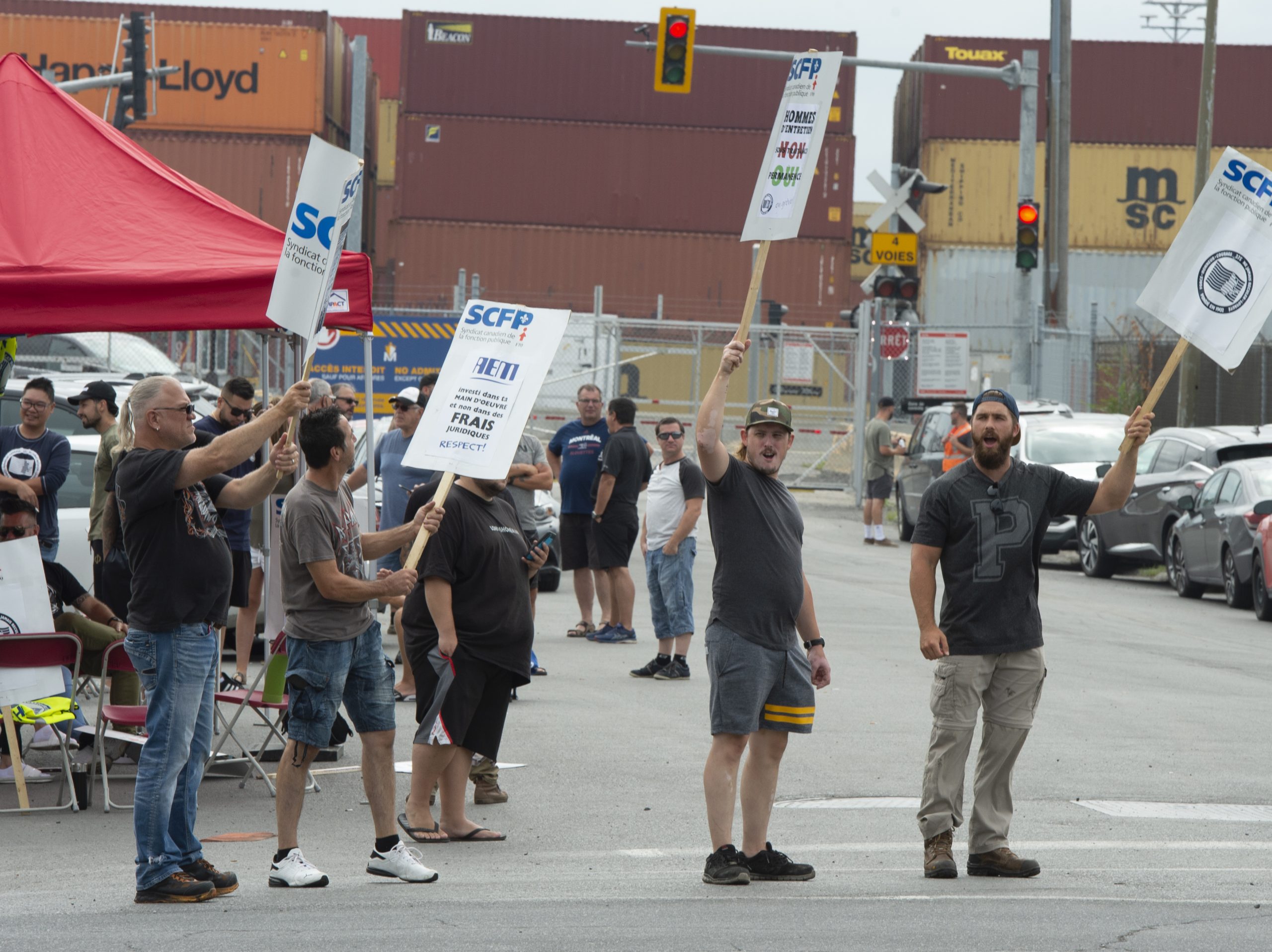 Dockworkers launch port strike in Montreal, shutting down terminals