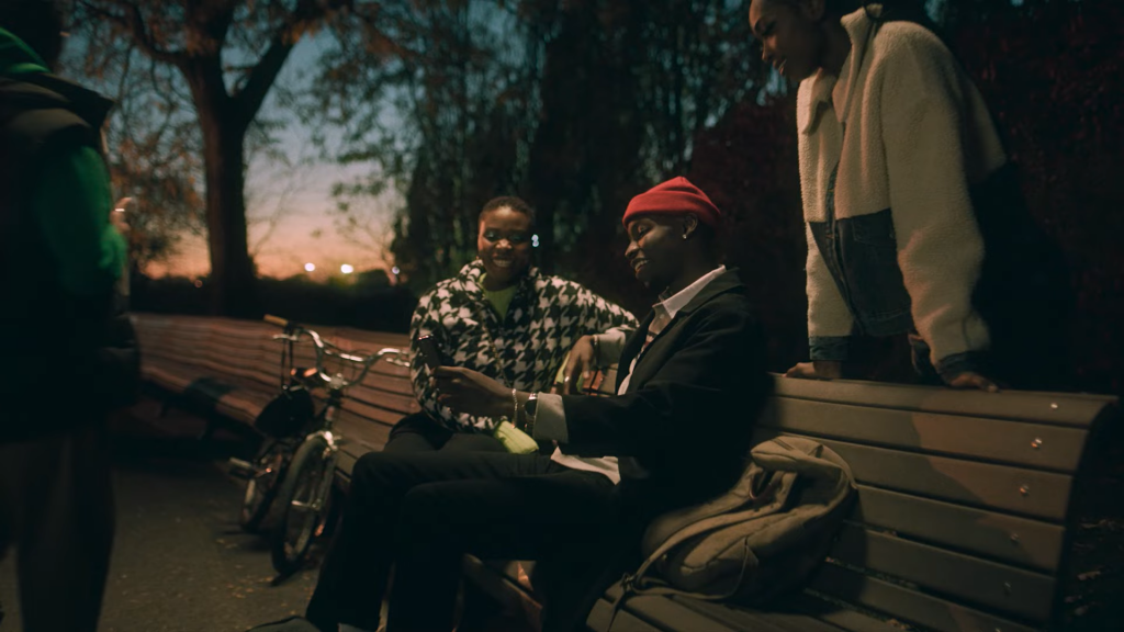 friends hang out on park bench