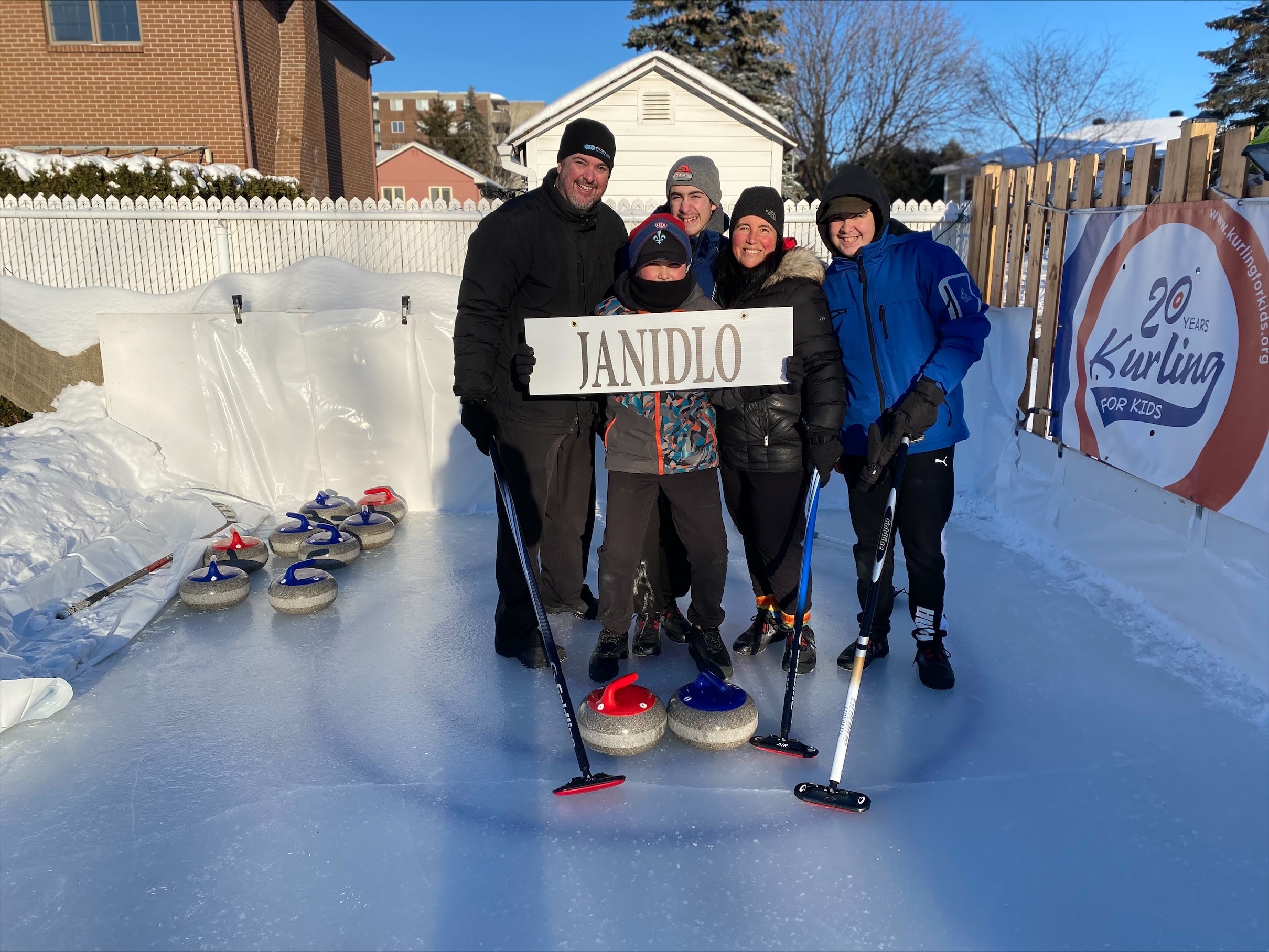 Montreal family builds curling rink in yard for their three boys