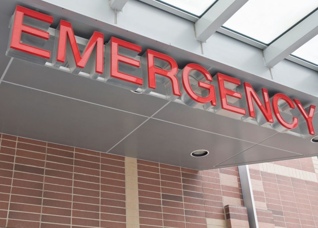 emergency room sign in front of hospital