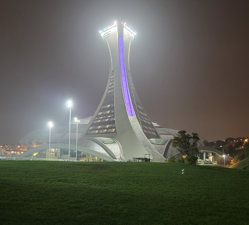 Olympic Stadium lit up in purple