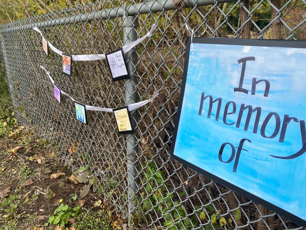 letters strung on fence