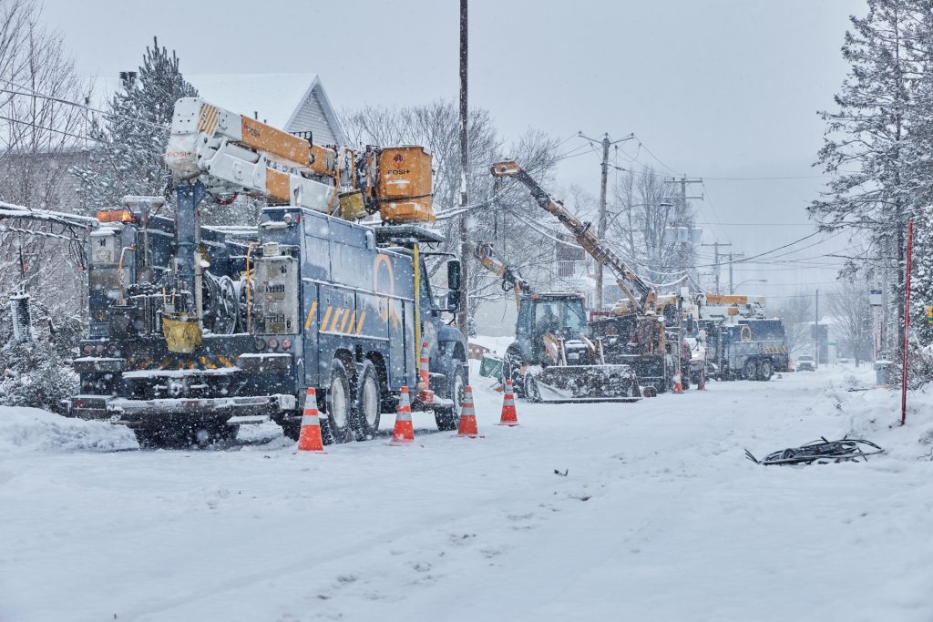 utility trucks in snowstorm