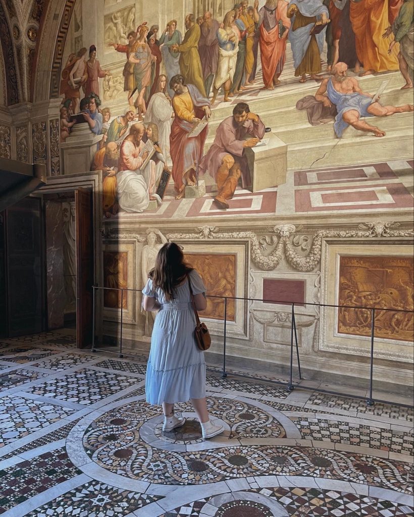 Woman looking at Roman art