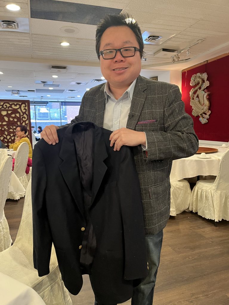 man holding suit jacket