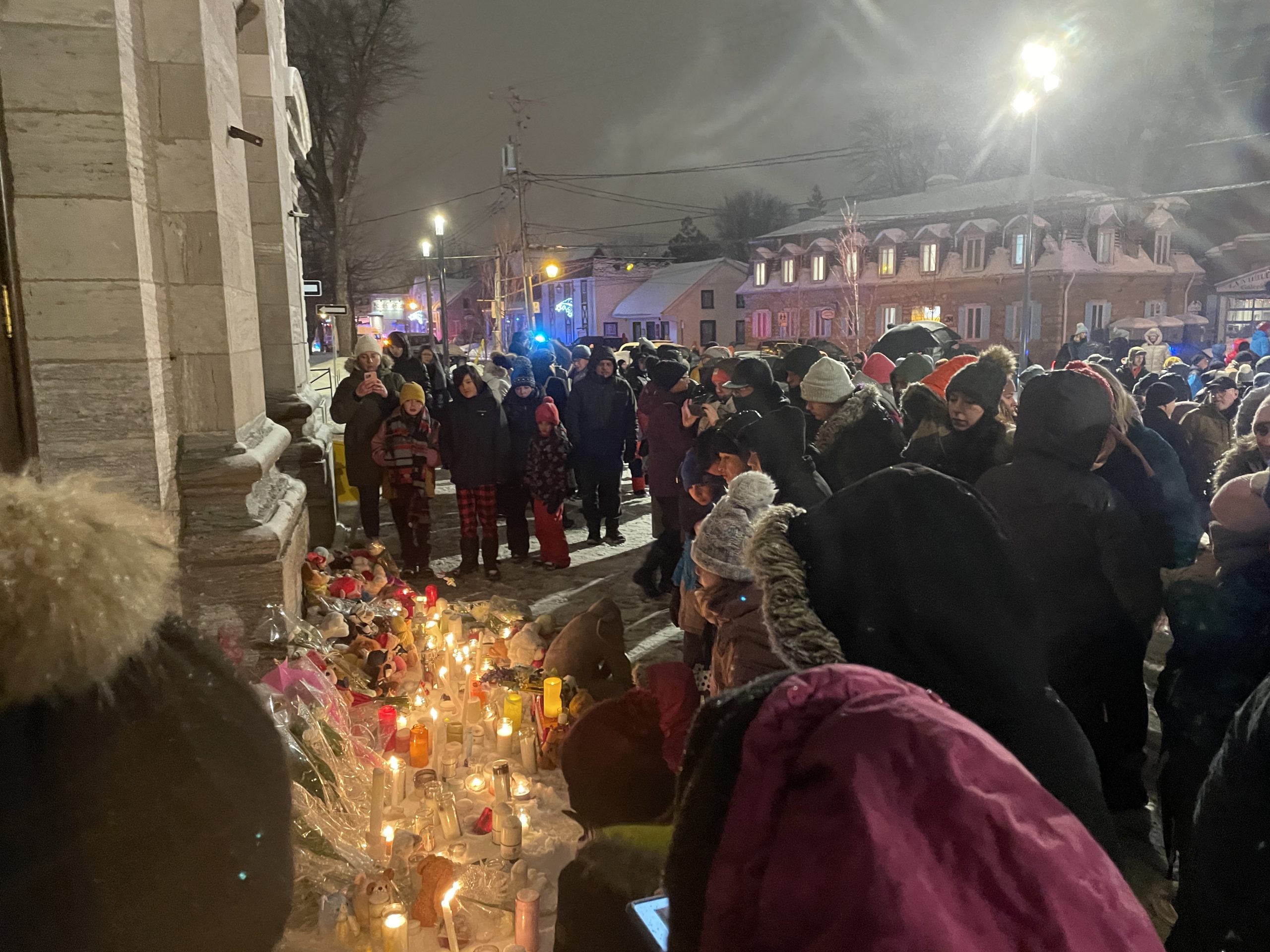 Laval's community leaving teddy bears, candles, and flowers for the victims of the Laval city bus crash