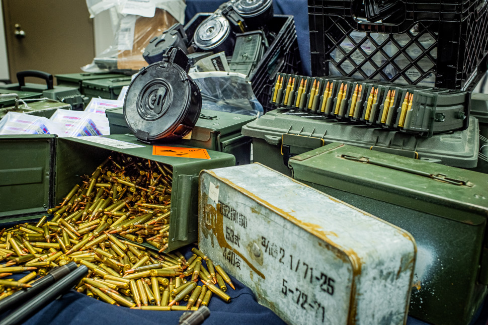 Seized firearms, weapon parts, military accessories, rounds of ammunition and high-capacity magazines