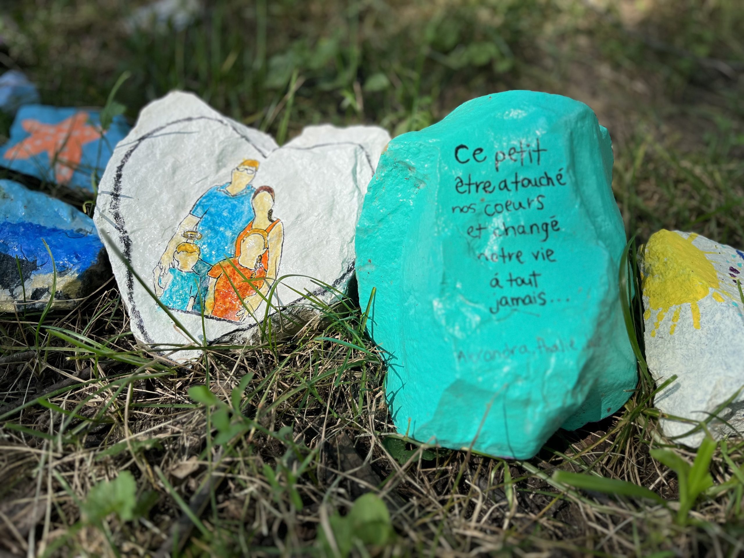 Laval daycare bus attack painted rocks memorial - for victim Jacob Gauthier - in Sainte-Rose,