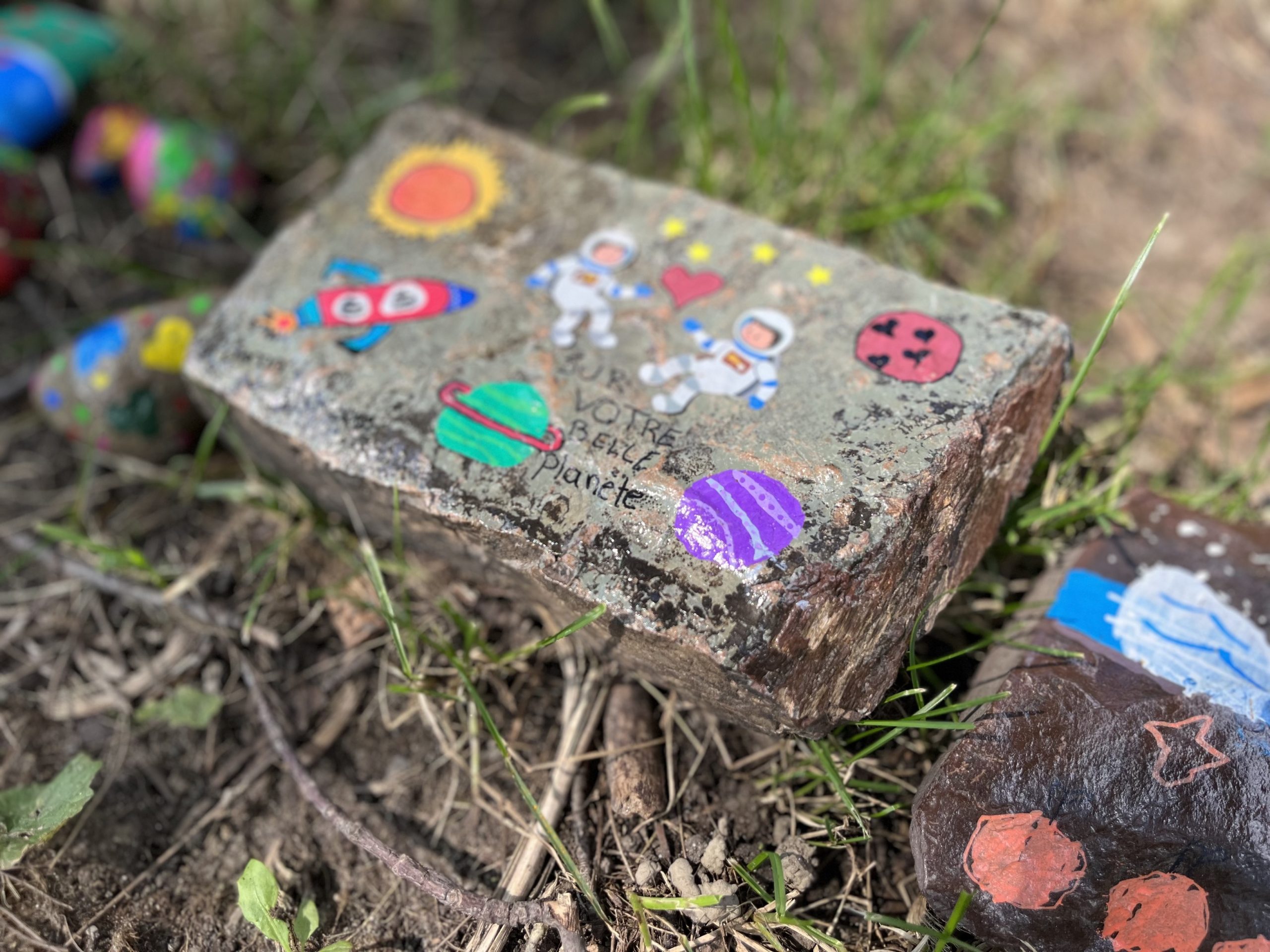 Laval daycare bus attack painted rocks memorial - for victim Jacob Gauthier - in Sainte-Rose,