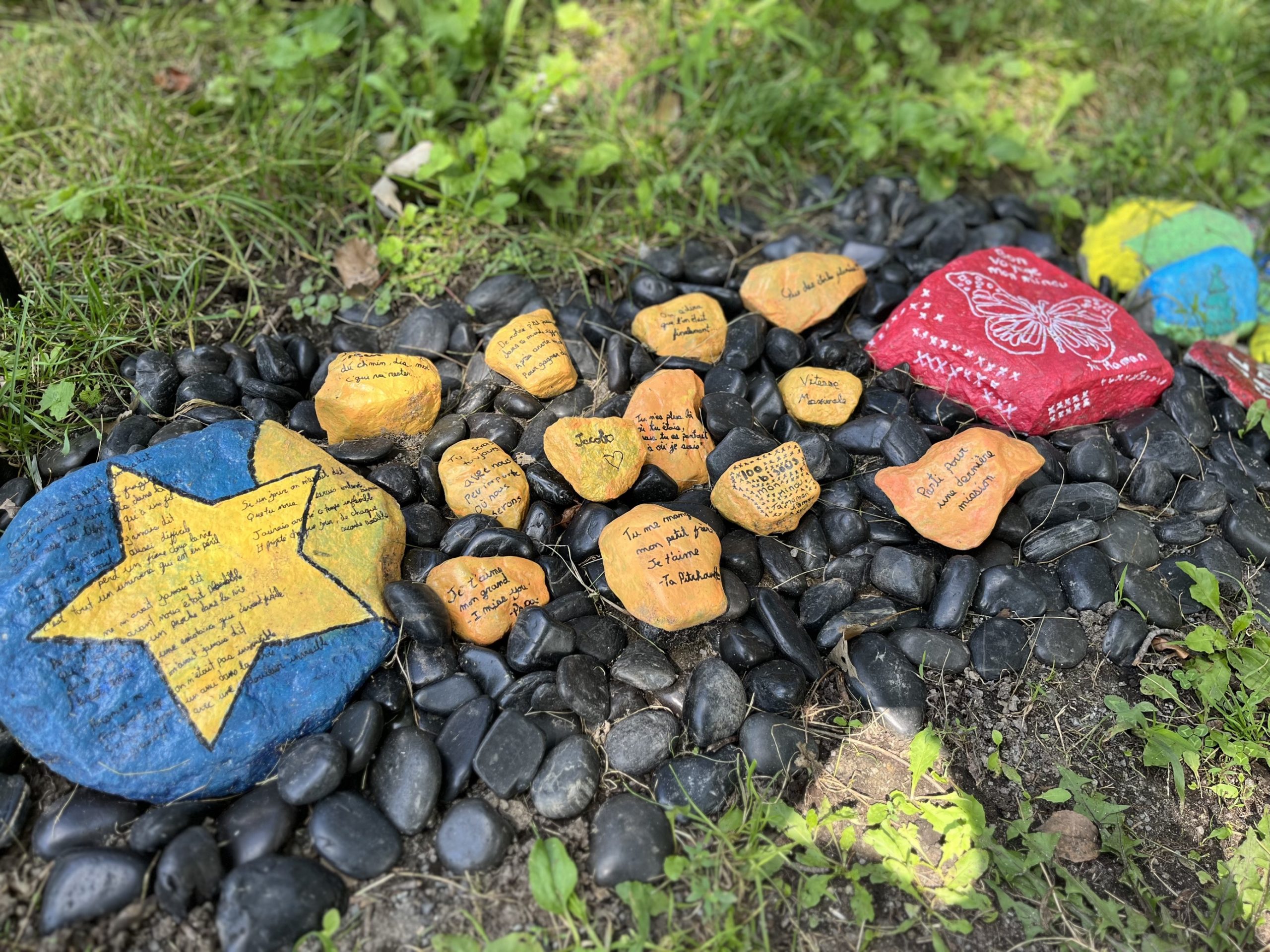 Laval daycare bus attack painted rocks memorial - for victim Jacob Gauthier - in Sainte-Rose,