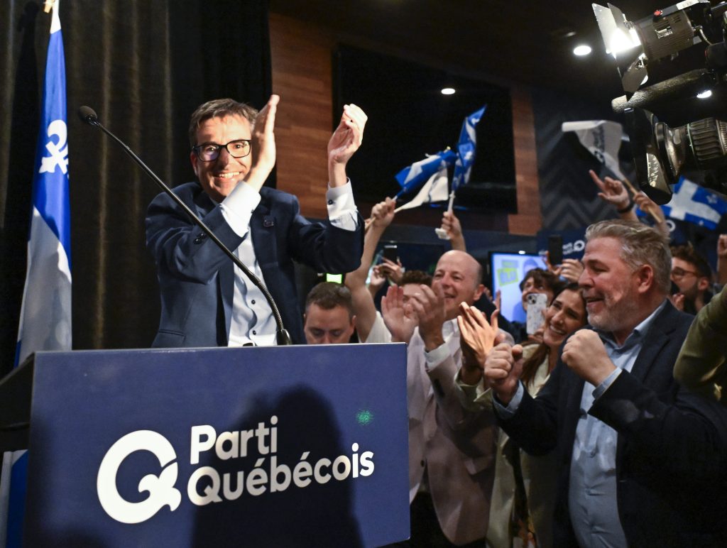 Parti Quebecois candidate Pascal Paradis celebrates his victory as he walks in to speak after being announced the winner in the Jean-Talon byelection, in Quebec City, Monday, Oct. 2, 2023.