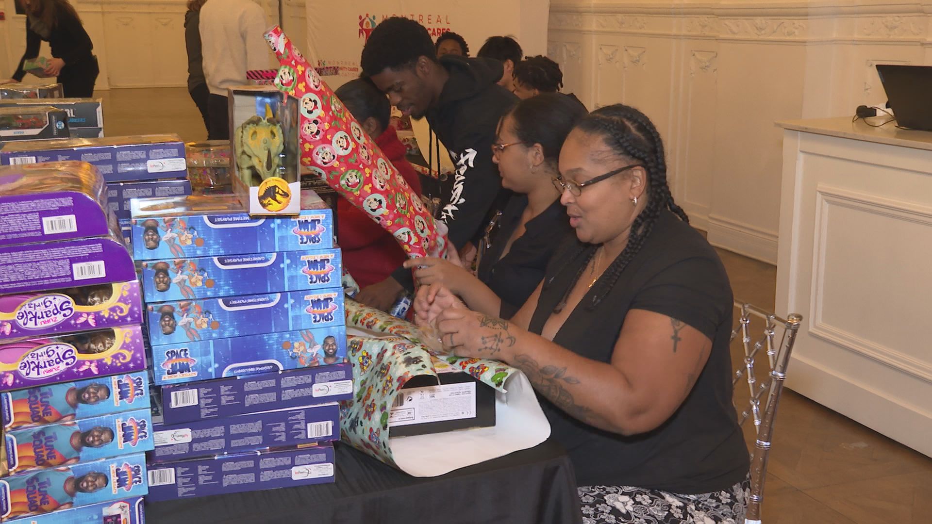 Volunteers wrap Christmas presents for Montreal kids