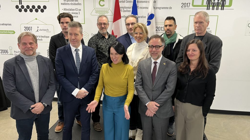 Valerie Plante is seen on taking a photo with other people at a press conference