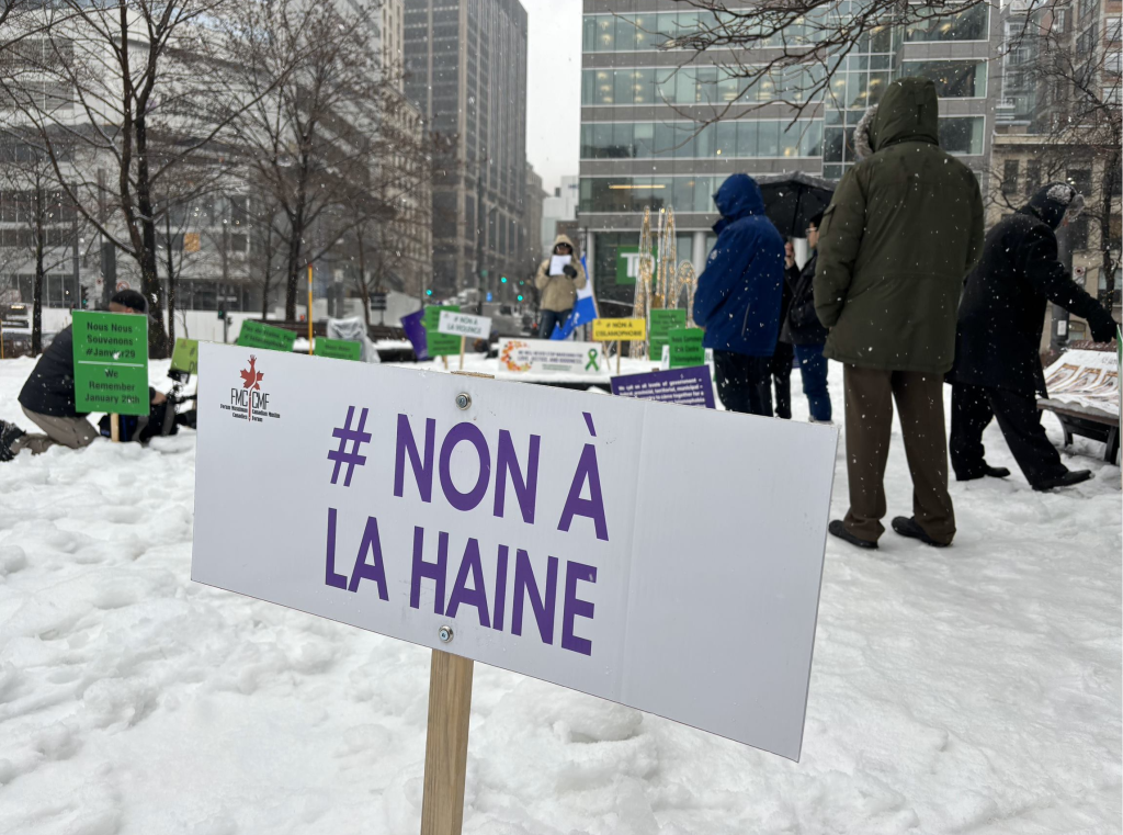 A close up of a sign saying no to hate is seen