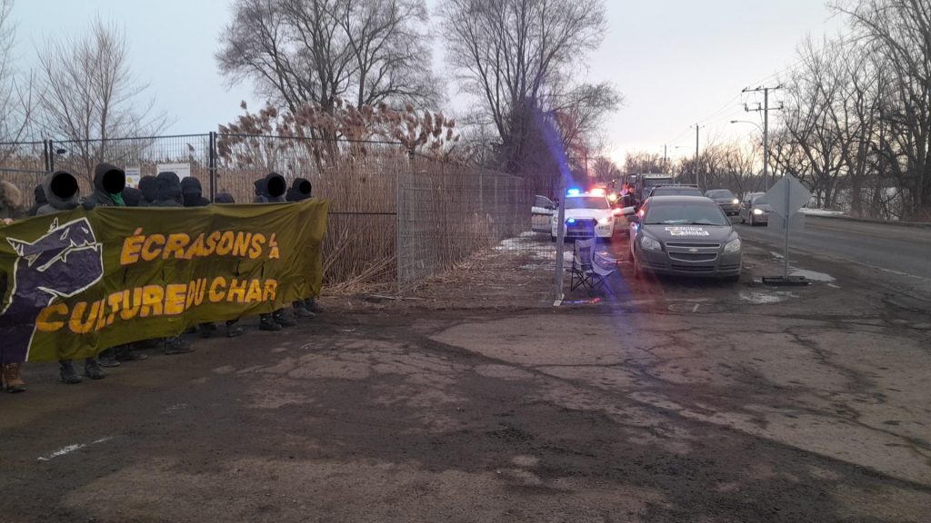 Activists from the Rage Climatique group protest at the entrance of the Northvolt battery plant