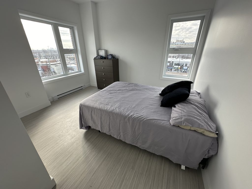 A bedroom is seen in a unit in ShelleyHouse