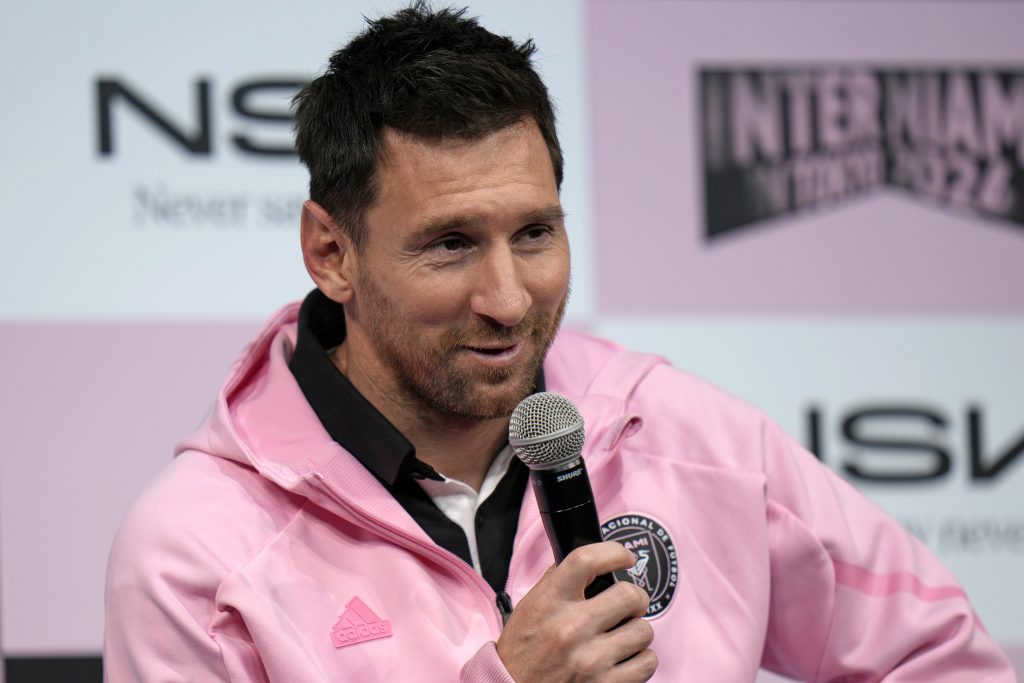 Inter Miami star Lionel Messi is seen in a pink track jacket at a press conference