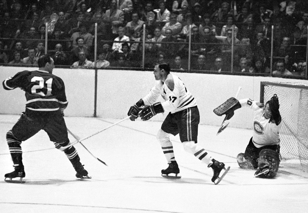 Jean-Guy Talbot is seen defending his net in the white jersey