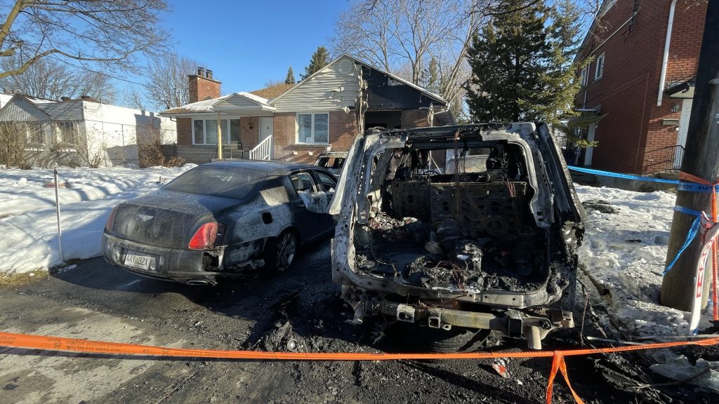 Cars are seen burnt with parts missing