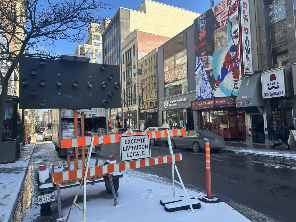 Construction signs are set up on Saint-Catherine Street in Montreal