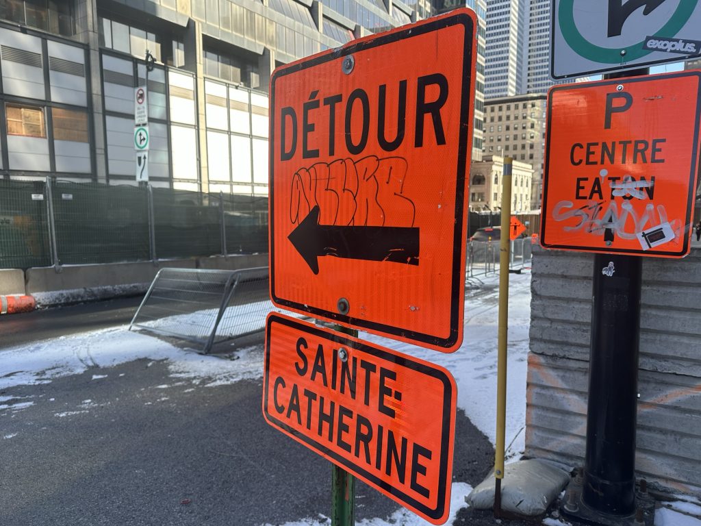 Orange detour signs are seen on Saint-Catherine Street in Montreal