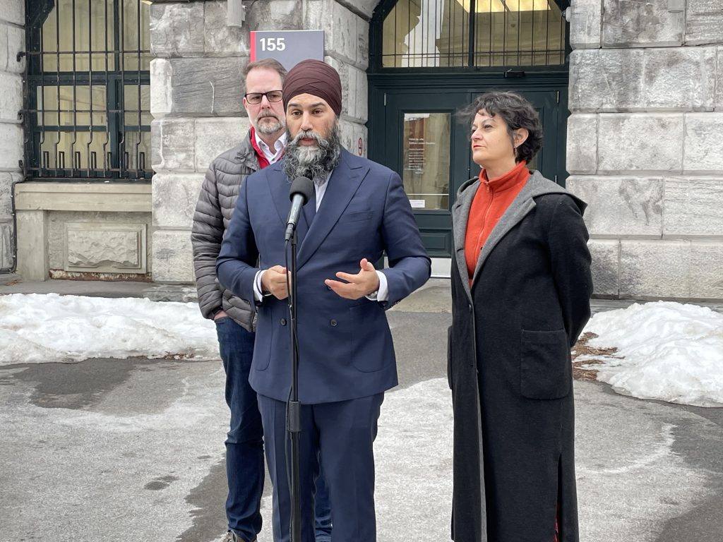 Jagmeet Singh is seen outside giving a speech in Montreal