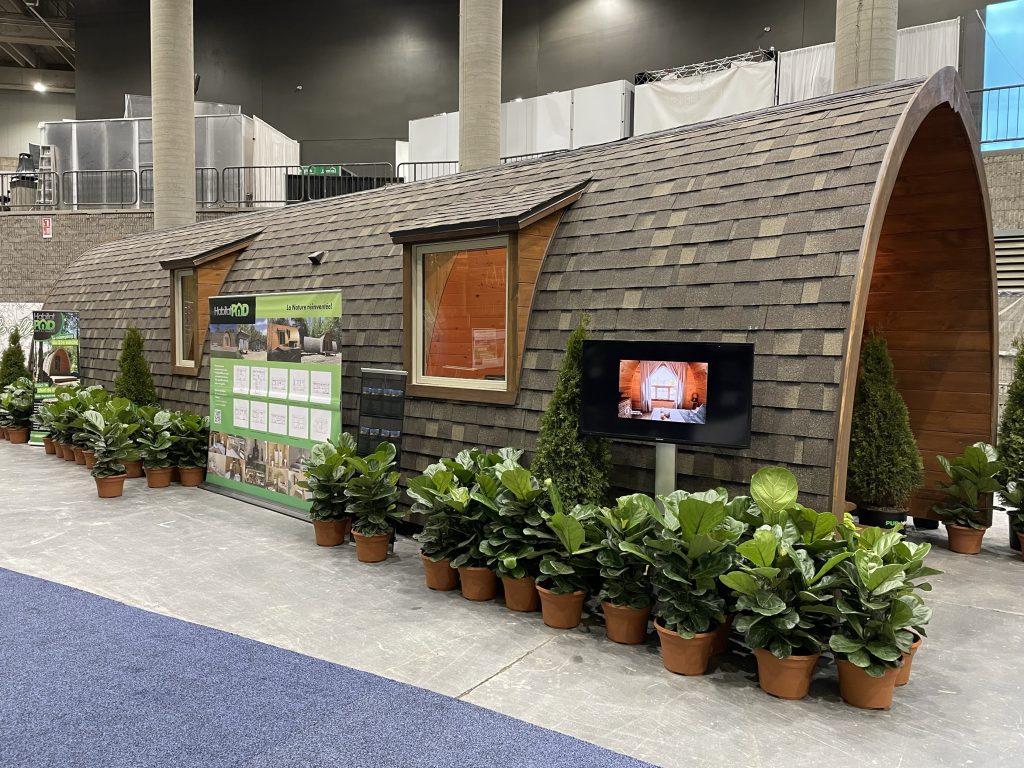 The HabitatPOD booth is seen at the Montreal HomeExpo, which looks like a giant log of wood