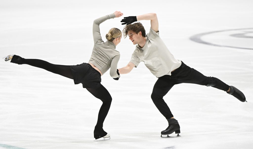 Gina Zehnder, Beda Leon Sieber are seen figure skating