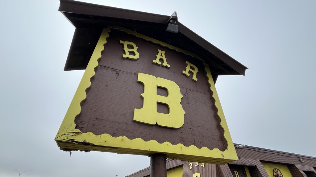 The Bar-B-Barn sign is seen up close