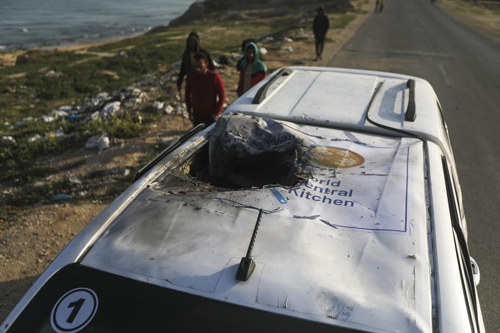 The founder of the global relief charity whose workers were killed by Israeli air strikes in the Gaza Strip on Monday is pleading with Israel to start the "long journey to peace."Palestinians inspect a vehicle with the logo of the World Central Kitchen wrecked by an Israeli airstrike in Deir al Balah, Gaza Strip, Tuesday, April 2, 2024. THE CANADIAN PRESS/AP/Ismael Abu Dayyah