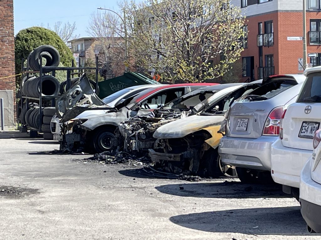 Burnt vehicles outside of Centre Silvauto in Montreal