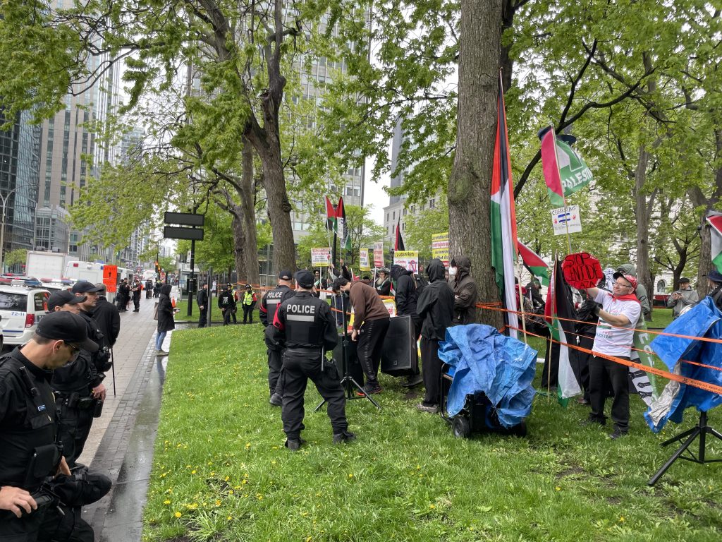 Pro-Palestinian protesters across the street of a at pro-Israel rally in downtown Montreal at Place du Canada for Israel Independence Day. May 14, 2024. (CityNews Image)