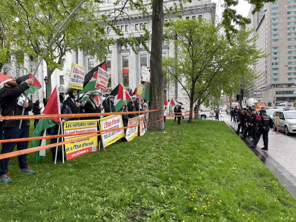 Pro-Palestinian protesters across the street of a at pro-Israel rally in downtown Montreal at Place du Canada for Israel Independence Day. May 14, 2024. (CityNews Image)