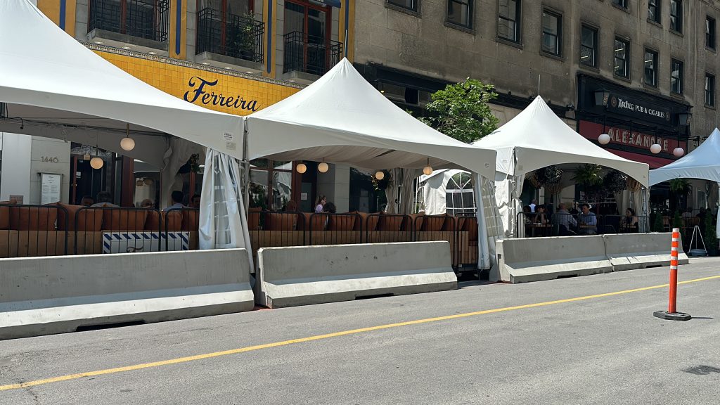 Tents on Peel terraces reinstalled as merchants of upcoming Montreal festival forced to buy new tents