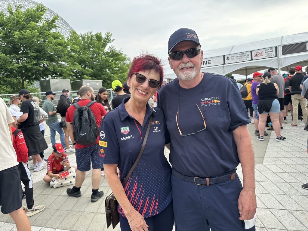 People pose for a photo near the Circuit Gilles Villeneuve