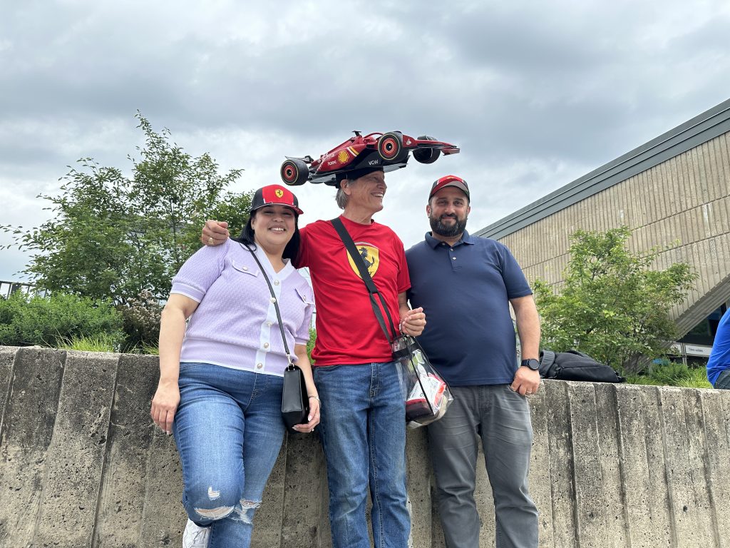 F1 fans pose for a photo at the Canadian Grand Prix open house