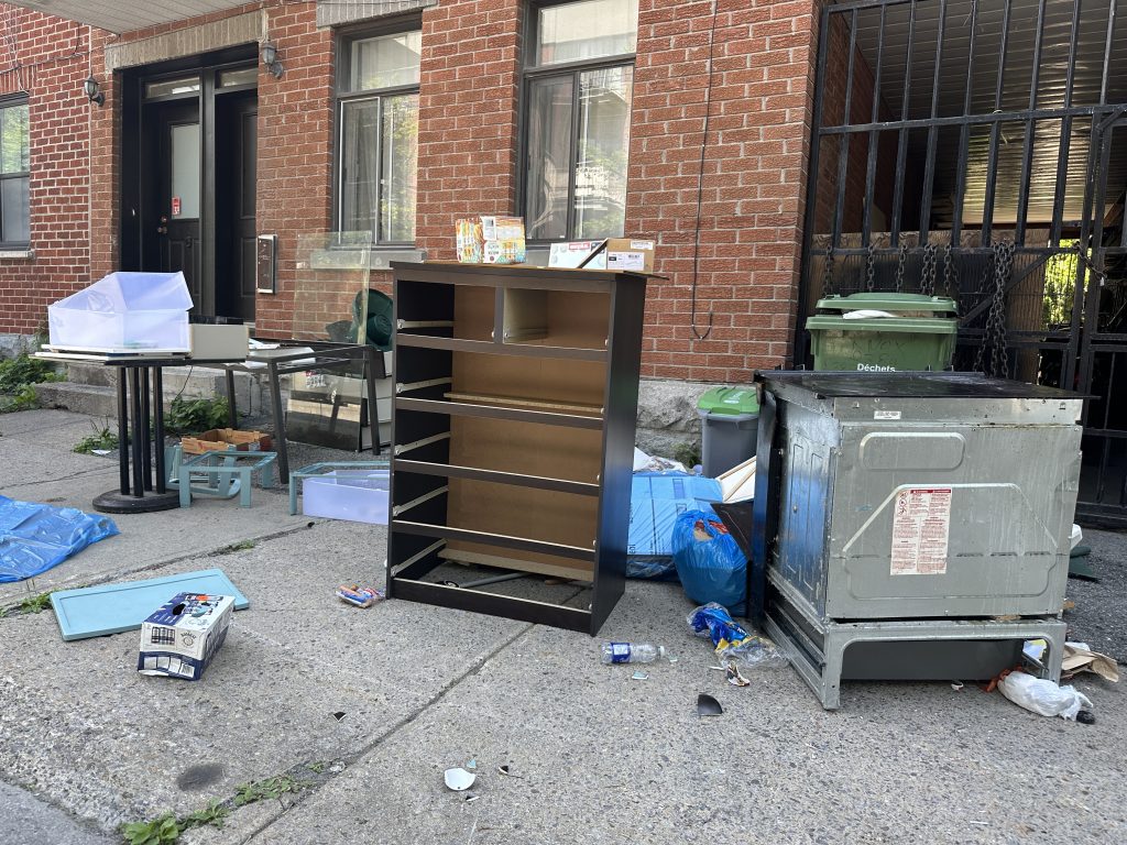 Junk left by the sidewalk one day after moving day in Montreal (July 2, 2024)