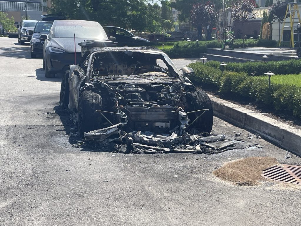 A torched car is seen