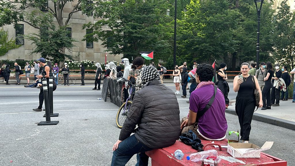 People outside the McGill campus as the school dismantles the pro-Palestinian encampment