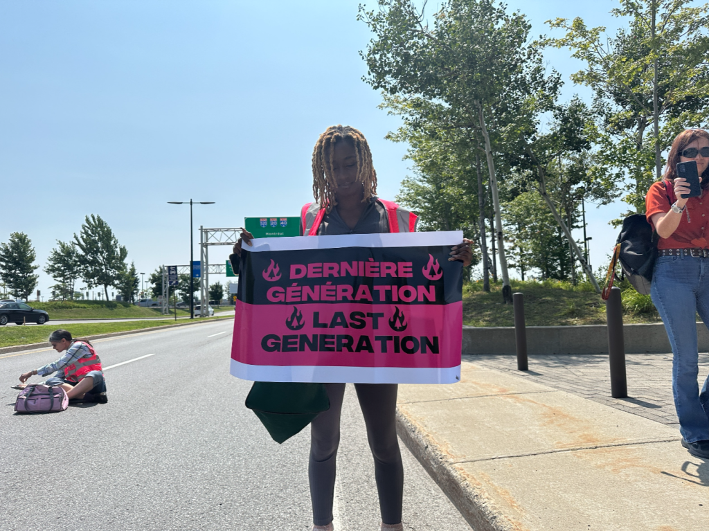 Protesters block the road at the Montreal-Pierre Elliott Trudeau International Airport