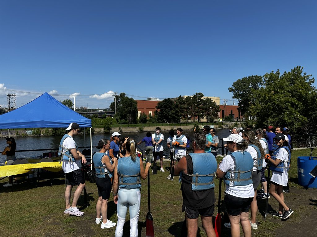 dragon boat race participants huddle up