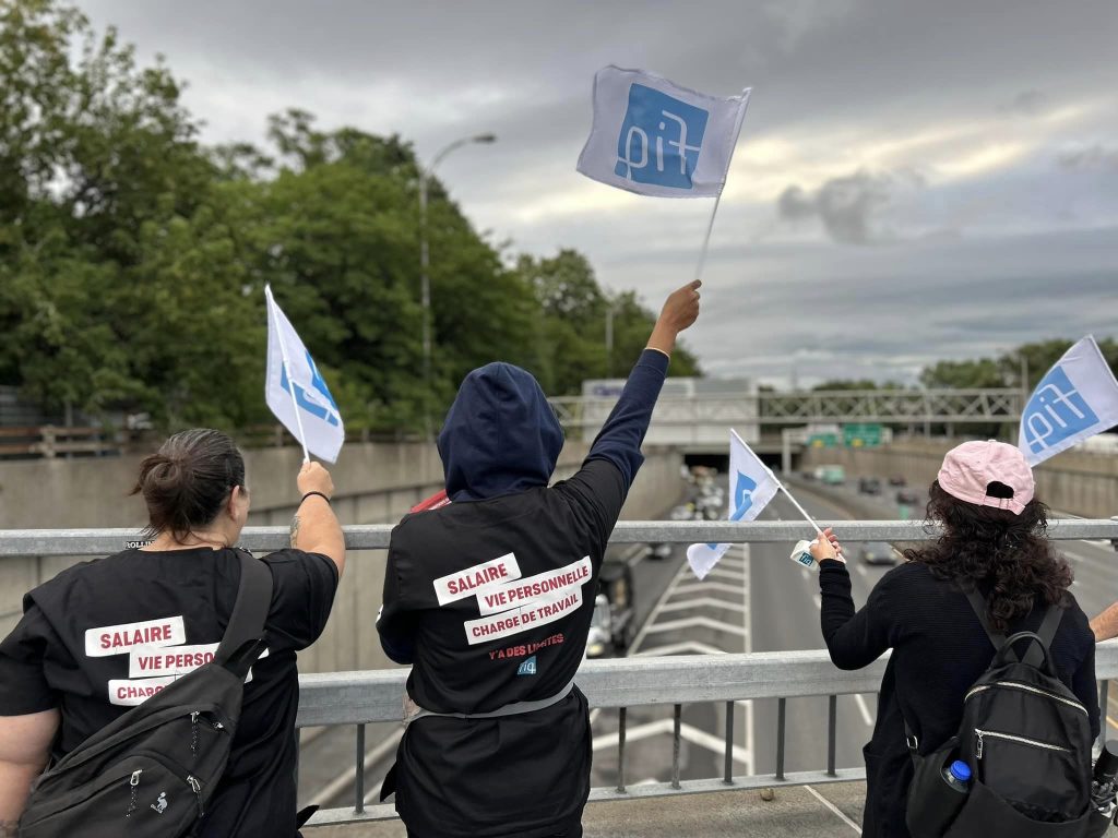 FIQ members protest above the Decarie Expressway