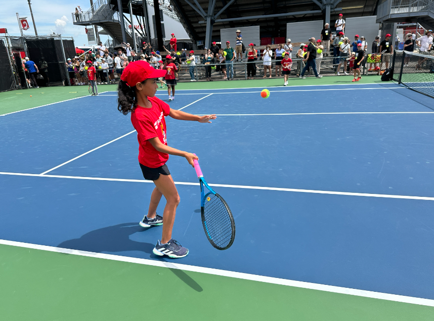 A child prepares to hit the ball