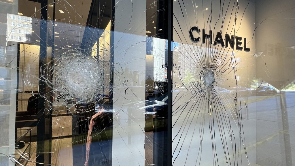 Protesters smash windows downtown, throw incendiary object at officer