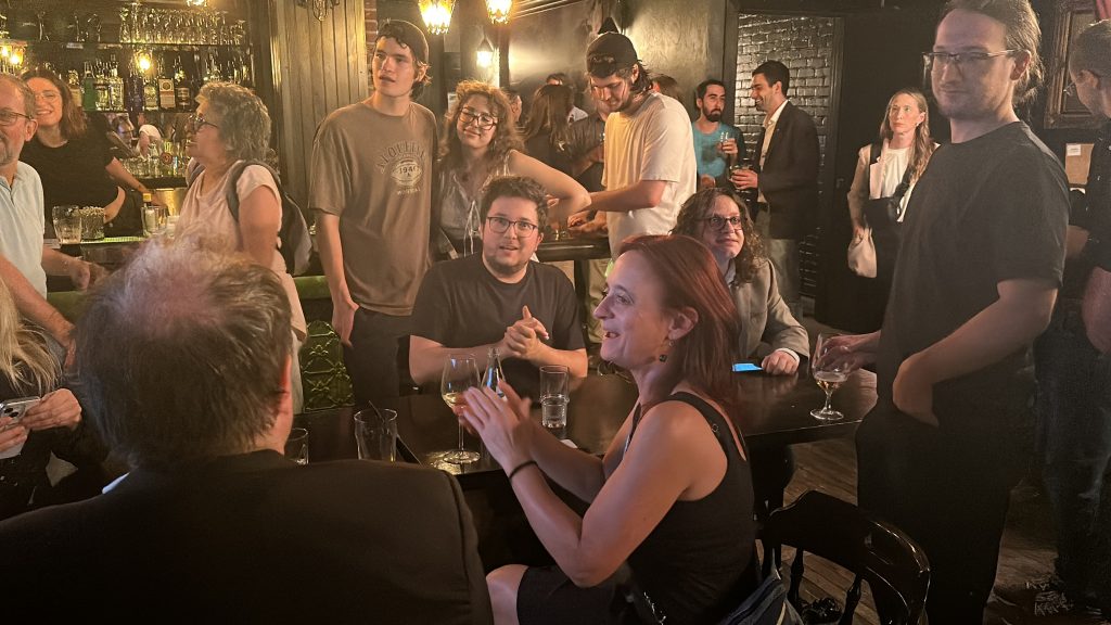 Bloc Québécois supporters seen clapping at the Pub Le Trèfle Taverne