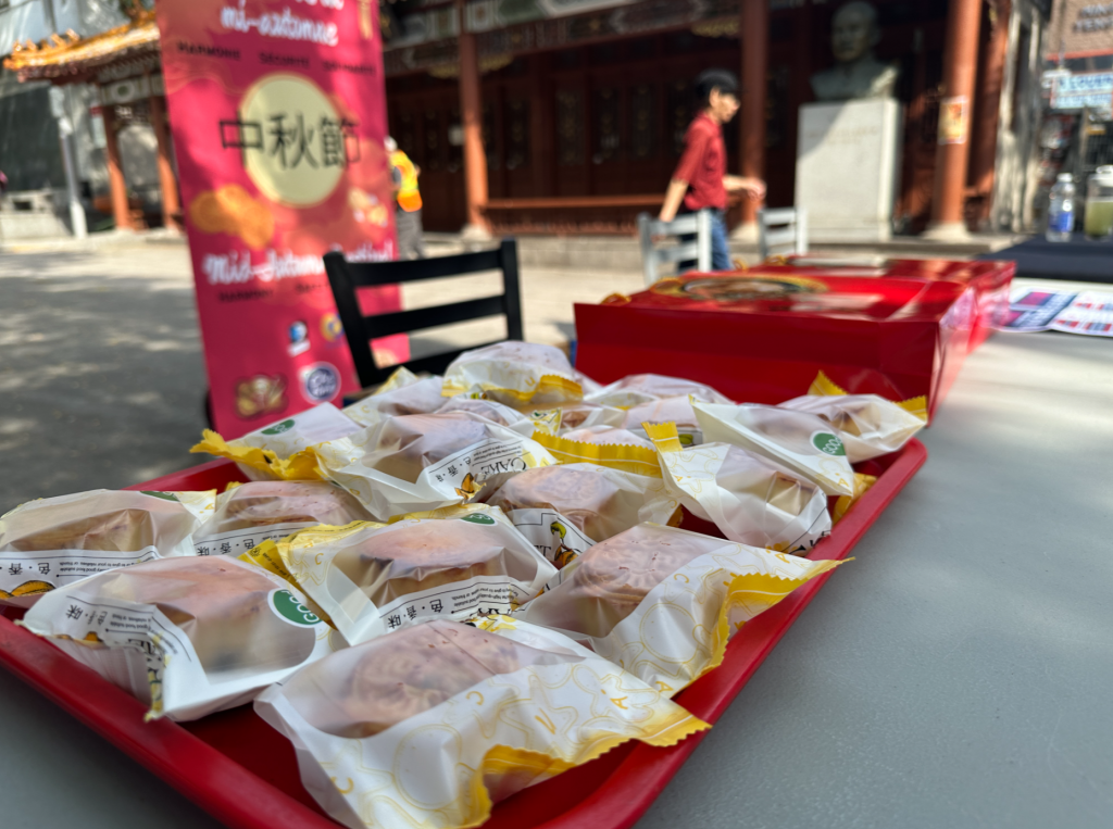 Chinatown residents and merchants distribute free mooncakes to encourage public safety