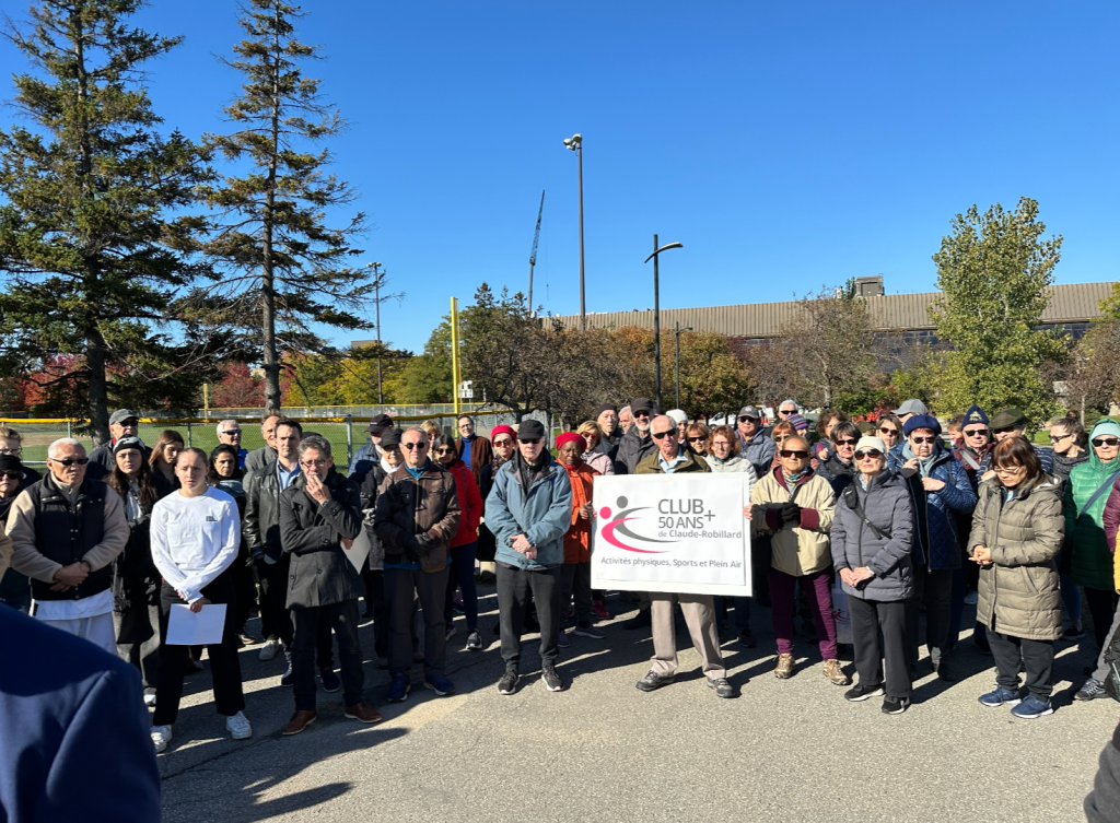 several people gather for a group photo