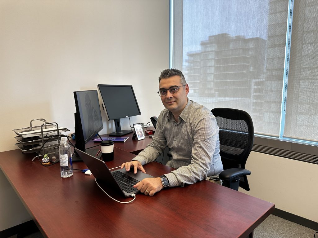 Erkan Yönder at his computer