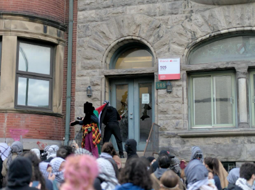 person smashes the windows at mcgill univerity