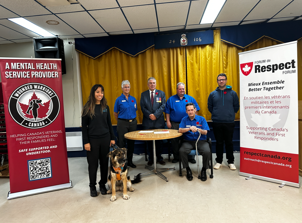 a group of people are seen with a service dog